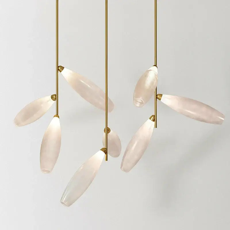 Modern white leaf pendant light with slender gold-toned rods and pale pink decorbites elegant glass led shades