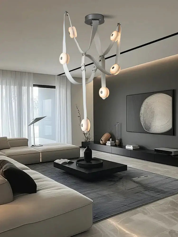 Modern white leather designer belt marble pendant lights feature sleek straps and circular frosted glass fixtures for decorbites