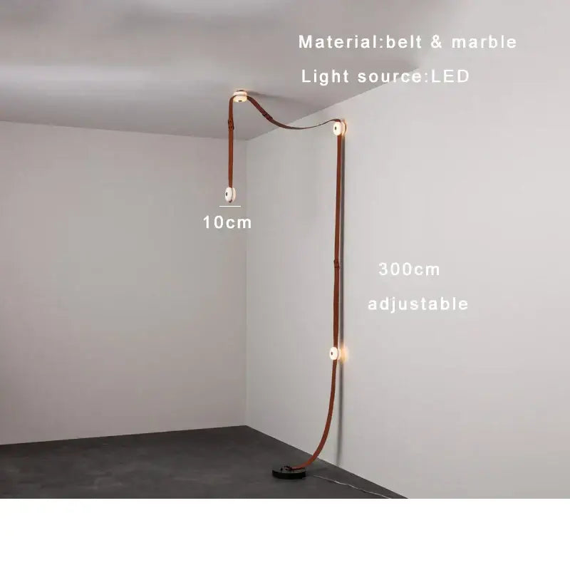 A sleek adjustable floor lamp featuring a brown leather decorbites designer belt and designer belt marble accents