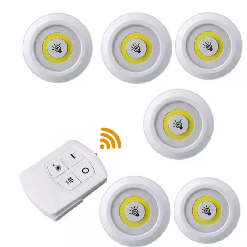Set of six white led cabinet lights with yellow illumination and remote control dimming for kitchen use