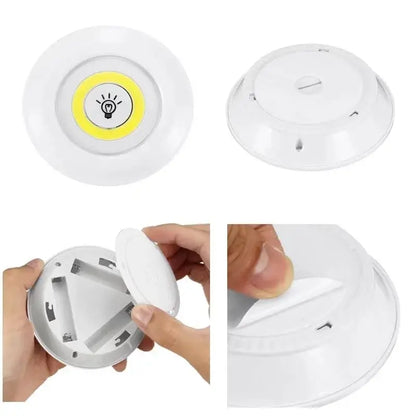 Modern white led cabinet light with remote control dimming featuring a yellow illuminated bulb and lightbulb icon center