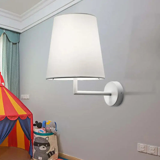 Modern white led cone wall mounted fabric sconce with a white fabric lampshade on a sleek metal arm and wall plate