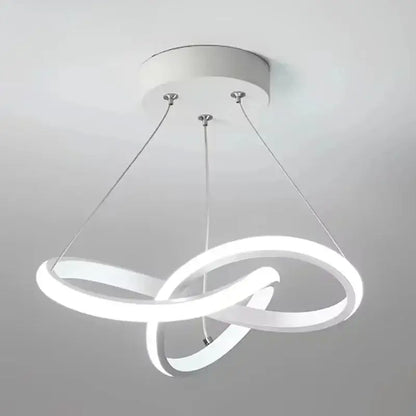 Modern white led pendant light with interlocking circular rings suspended by thin metallic cords helps create ambiance