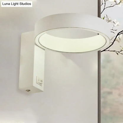 Modern white led wall sconce with sleek minimalist design and direct wired power source for living room lighting