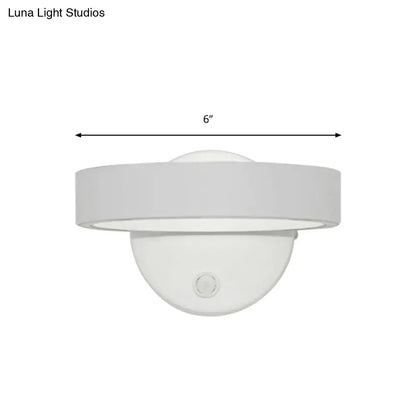 Modern white led wall sconce with sleek circular design 6-inch diameter direct wired bulb included for living room use