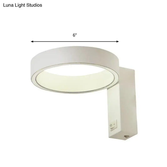 Modern white led wall sconce direct wired with a sleek circular design and 6-inch diameter power source for living room