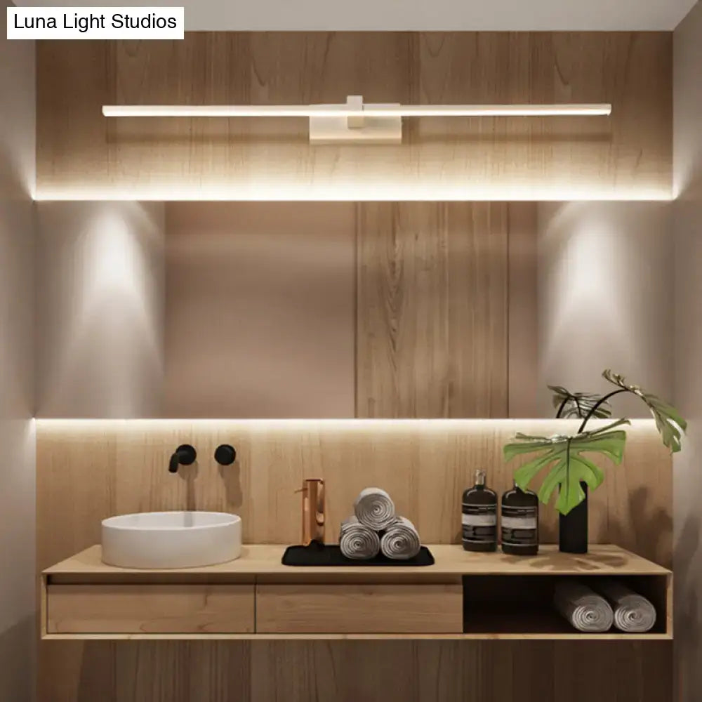 DecorBites™ modern linear LED wall sconce above a minimalist bathroom vanity with white ceramic sink and wooden countertop