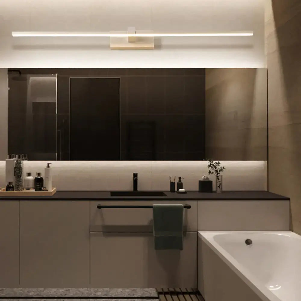 Modern minimalist bathroom vanity with sleek black countertop and matte white cabinets featuring DecorBites wall sconce