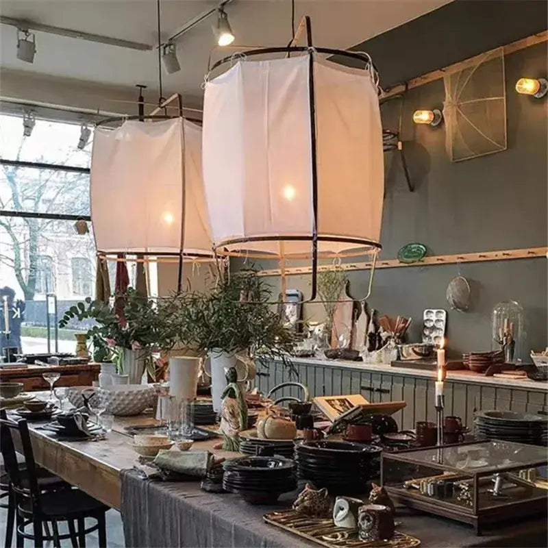 Modern white linen cotton pendant lamp with black metal frame hanging as kitchen island lighting decorbites linen cotton