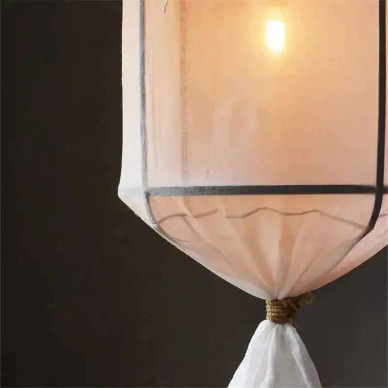 Modern white linen cotton pendant lamp with soft peach sheer fabric and dark metal frame for kitchen island lighting decorbites linen cotton pendant