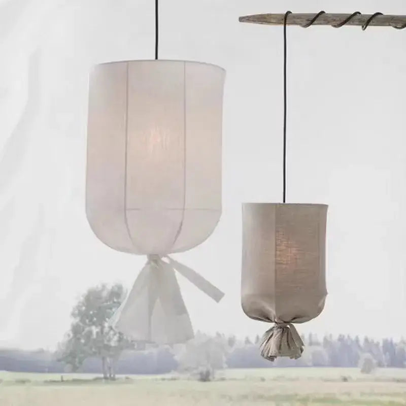 Two cylindrical pendant lamps in soft off-white and muted beige decorbites linen cotton pendant for kitchen island lighting