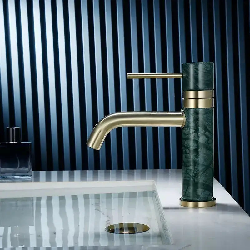A modern white marble and dark green marble bathroom faucet with brushed gold swivel spout accents decorbites brushed gold