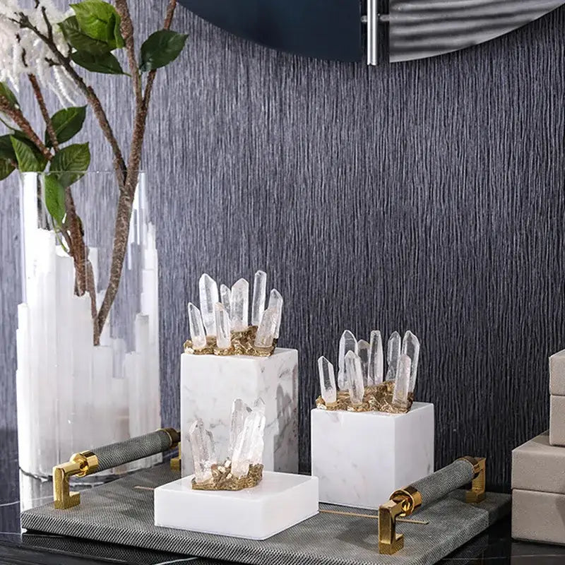 Set of three modern white marble crystal stone sculptures with clear quartz and golden accents for living room decor