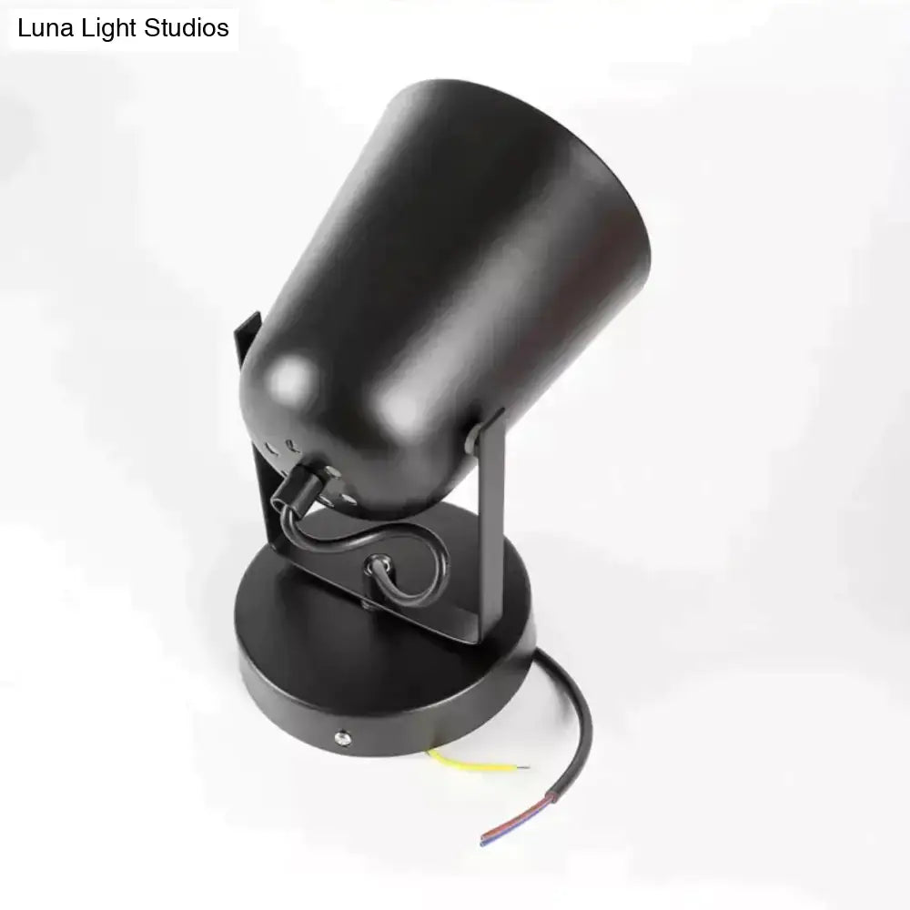 Black matte-finished adjustable spotlight with cylindrical head and circular base for modern ferrell wall lamp use
