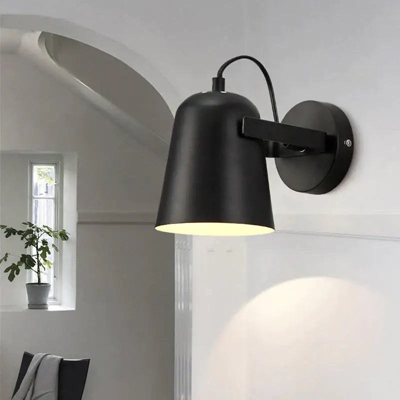 Black matte ferrell wall lamp with conical shade and adjustable arm for modern bedroom spotlight lighting