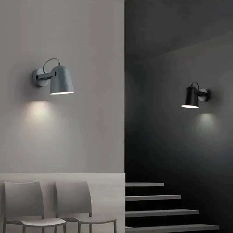 Modern white matte adjustable ferrell wall lamp with sleek metal body and adjustable arms for bedroom lighting