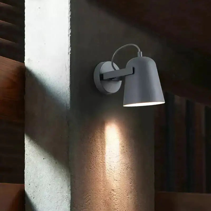 Gray minimalist ferrell wall lamp with sleek adjustable arm and matte finish for modern bedroom spotlight use