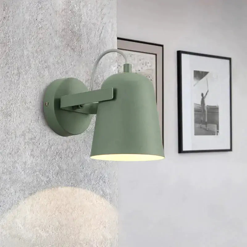 Matte sage green metal ferrell wall lamp with curved arm and conical shade for modern adjustable bedroom lighting
