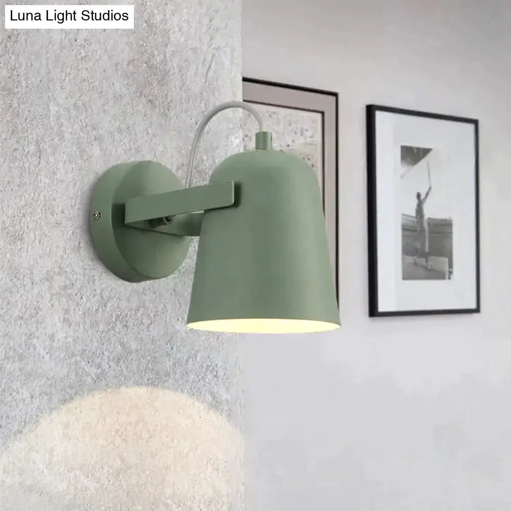Modern sage green ferrell wall lamp with matte metal shade and curved arm for adjustable bedroom spotlight lighting