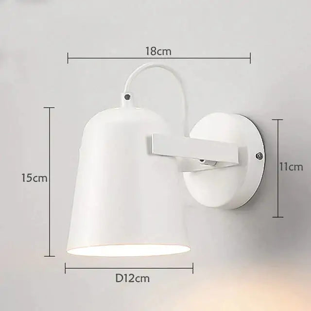 Modern white matte ferrell wall lamp with a sleek conical shade and circular mounting plate for bedroom spotlight use