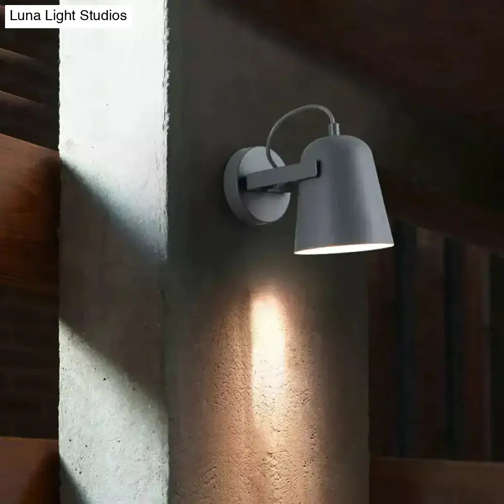 Modern white matte ferrell wall lamp with gray minimalist adjustable arm and conical shade for bedroom spotlight lighting