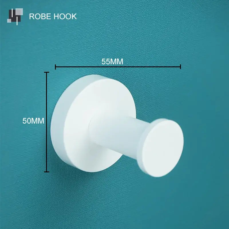 Modern white matte metal bathroom accessory set featuring a white plastic robe hook with circular base decorbites bathroom accessory
