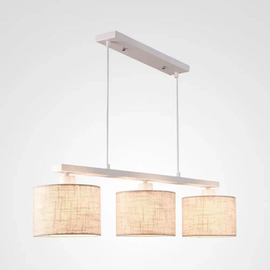 Decorbites modern white metal island light fixture with three beige fabric shades for kitchen use