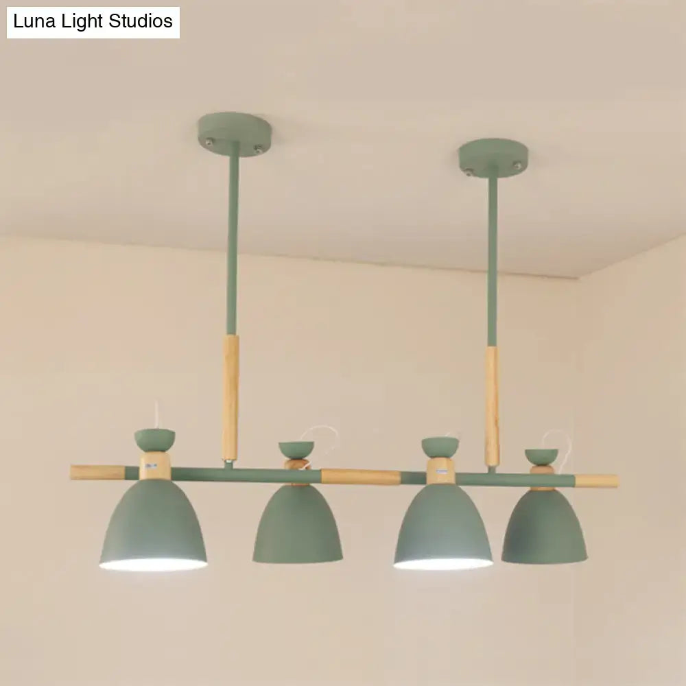 Modern green and wood-toned metal dome shade island chandelier with four dome-shaped shades for kitchen islands