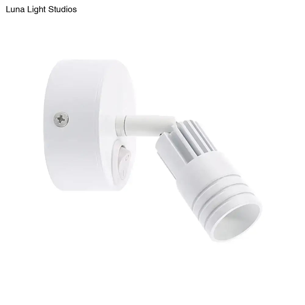 Modern white metal wall mounted led spotlight with adjustable head and ribbed heat sink for bedroom reading light