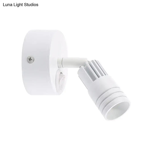 Modern white metal wall mounted led spotlight with adjustable head and ribbed heat sink for bedroom reading light