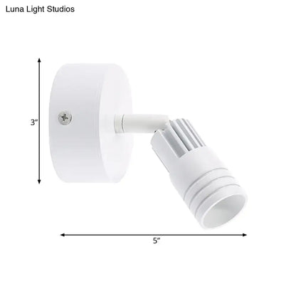Modern white metal wall mounted led spotlight with adjustable arm for targeted illumination in bedroom reading light use fixture