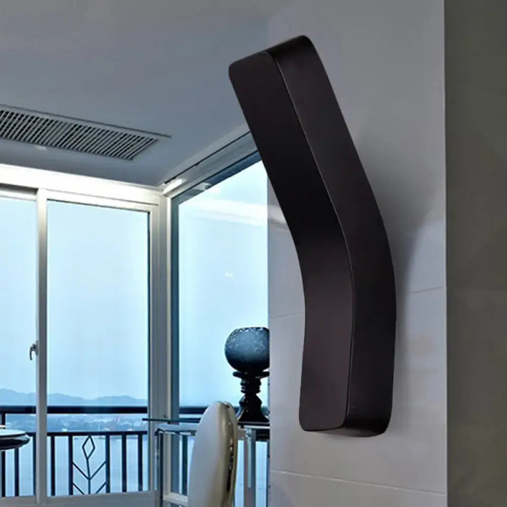 Black curved wall-mounted speaker with sleek modern design paired with modern white minimalist led wall light 110v-120v 220v-240v