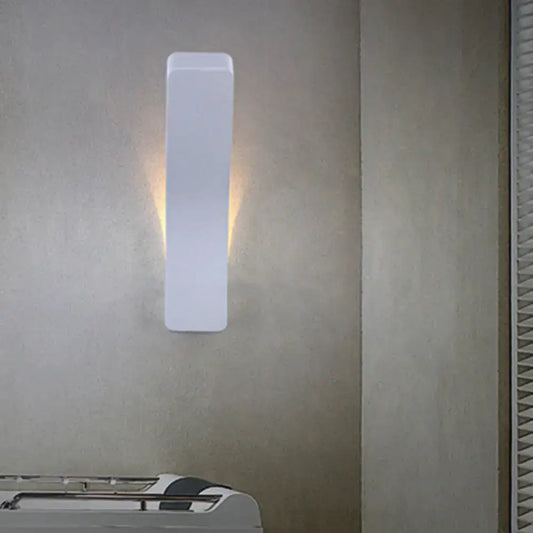 Modern white minimalist led wall light with sleek rectangular design emitting warm ambient light for 110v-120v and 220v-240v