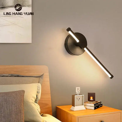 Black modern wall sconce with sleek angular design and circular base for minimalist bedroom decorbites led wall lamp