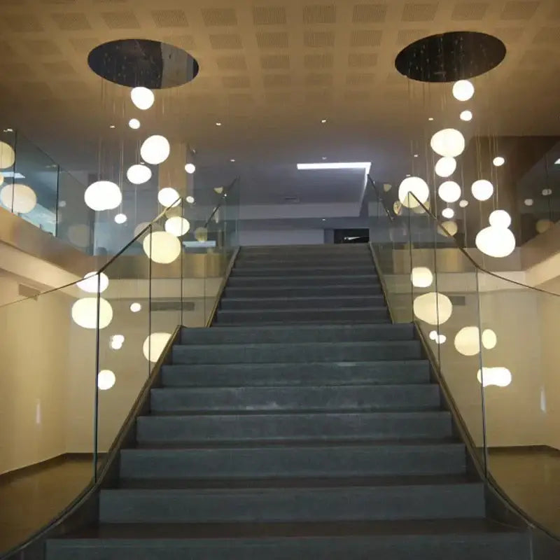 Modern white minimalist spherical pendant lights with decorbites cobblestone glass led hang from black mounts
