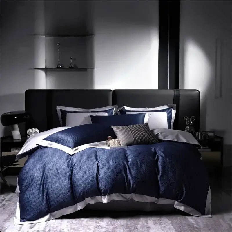 Navy blue textured duvet cover set with white piping and pillowcases in modern white and navy egyptian cotton luxury bedding set