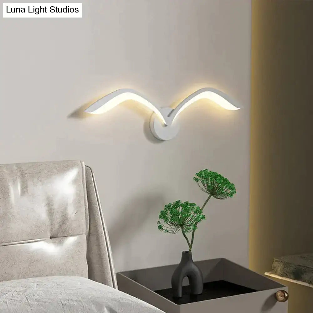 Modern white nordic avian style wall lamp with sleek curved wing design for style indoor bedroom use
