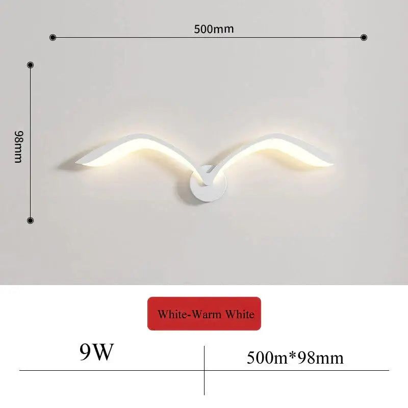 Modern white nordic avian style wall lamp shaped like wings emitting warm white light for indoor bedroom use