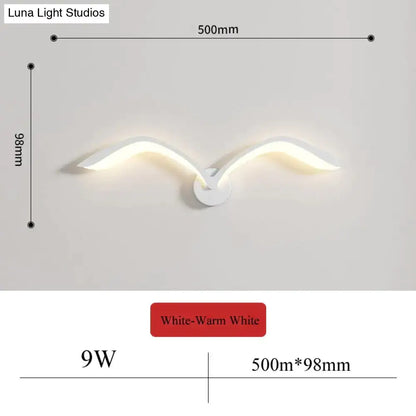 Modern white nordic avian style wall lamp shaped like a seagull with warm white lighting for indoor use