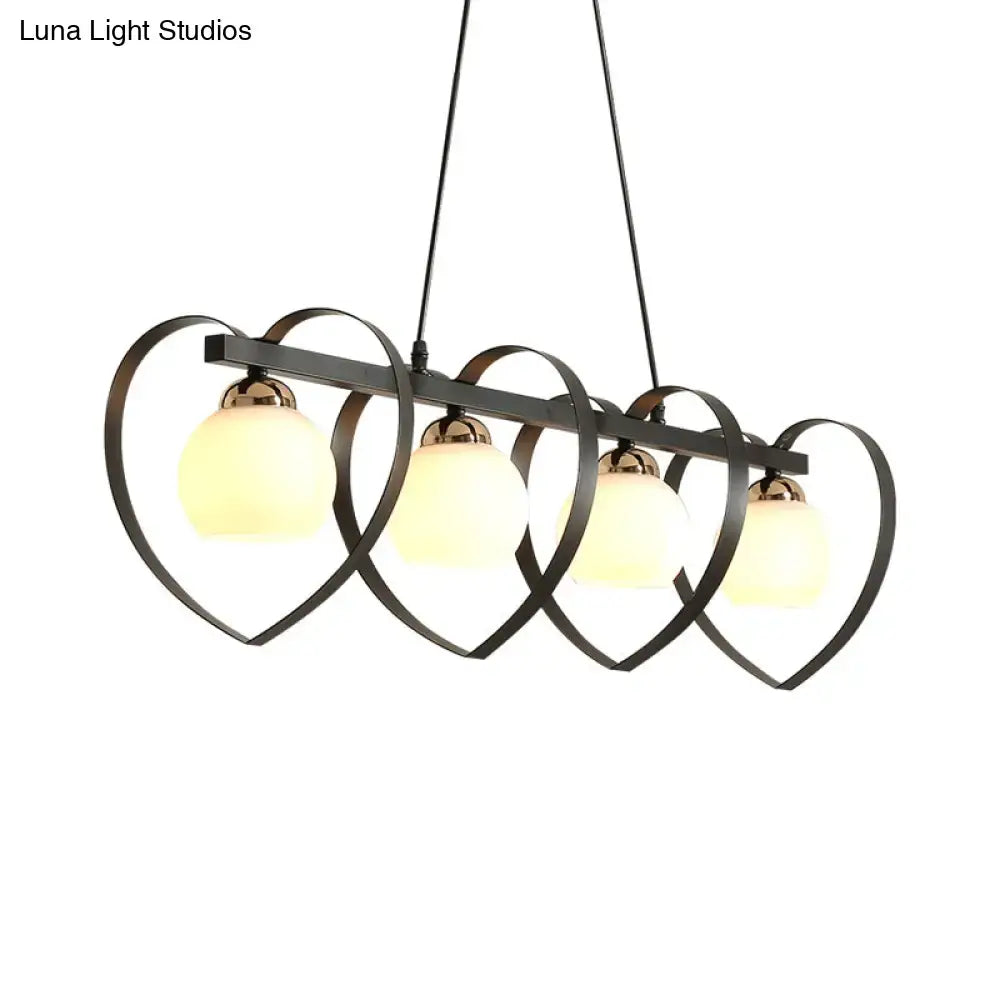 Modern black metal chandelier with four heart-shaped frames and frosted opal glass globes for 110v-120v bulb base e26 e27