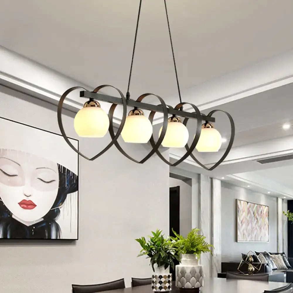 Black metal chandelier with four heart-shaped frames and frosted opal glass globes compatible with e26 e27 bulb base and 110v-120v
