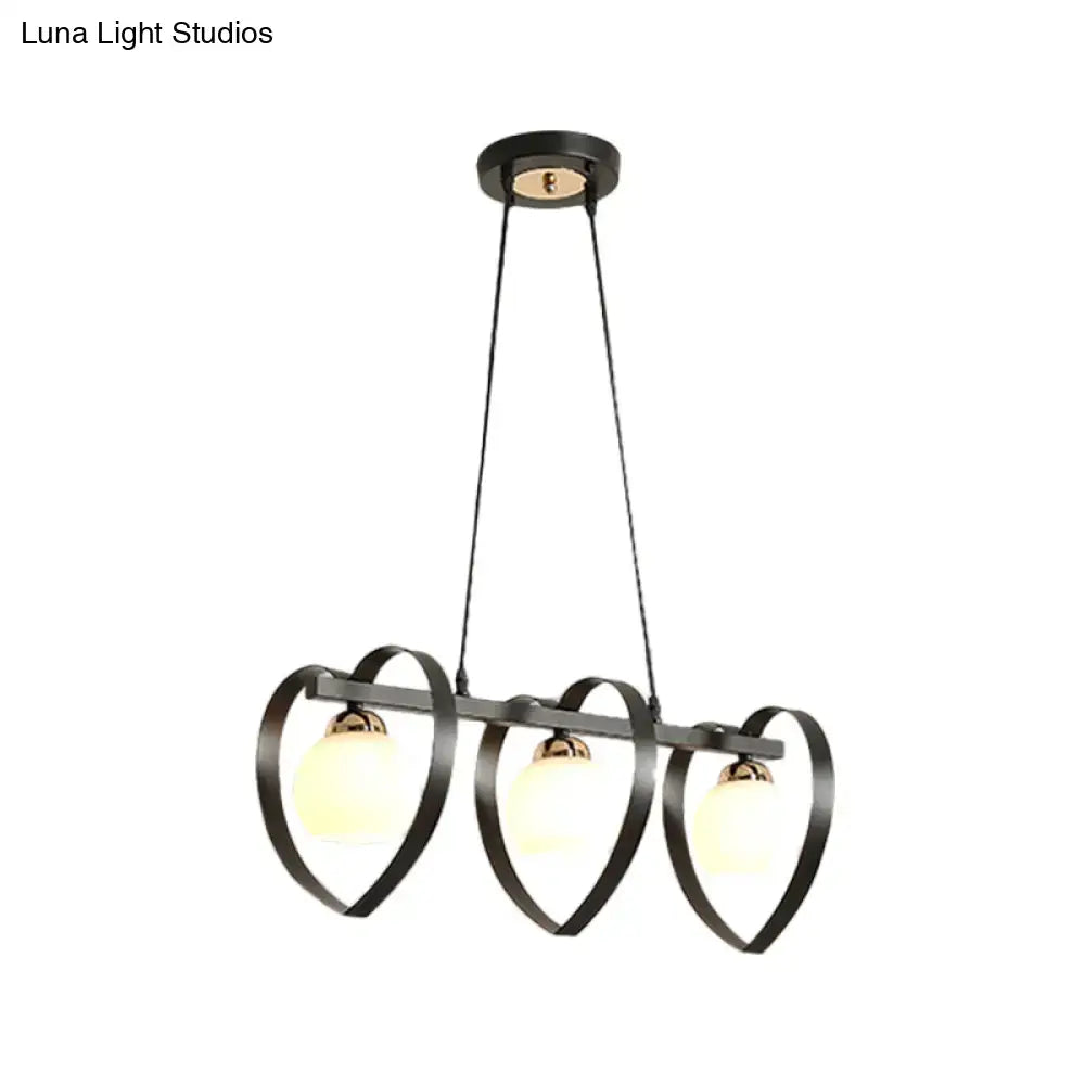 Black metal chandelier with three heart-shaped frames and frosted opal glass globe bulbs 110v-120v white black bulb base