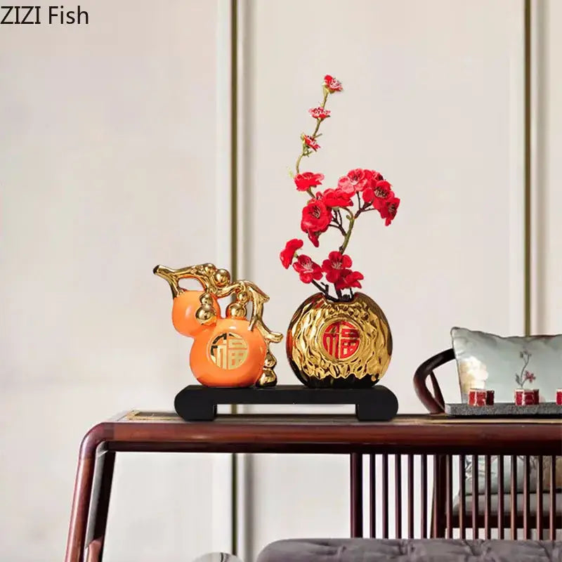 Modern white and orange decorbites golden gourd ceramic sculpture with red floral arrangement for living room decor