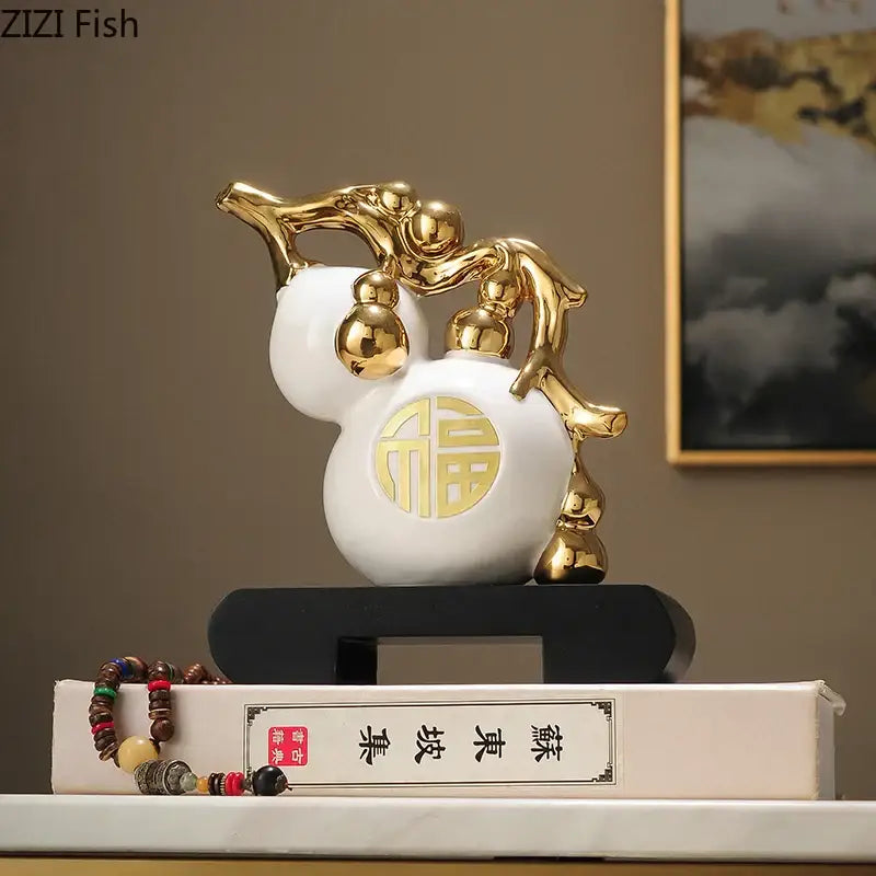 Modern white and orange golden gourd ceramic sculpture with gold accents and circular 福 character for living room decorbites decorbites golden gourd decor