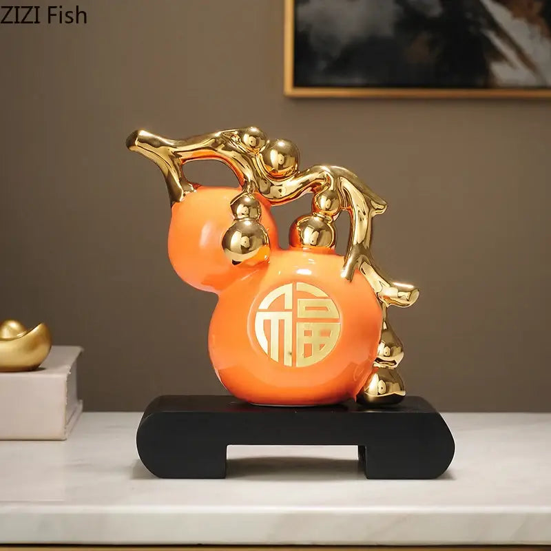 Modern white and orange golden gourd ceramic sculpture with gold accents featuring chinese character design decorbites golden gourd