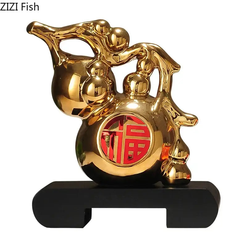 Golden gourd ceramic fish sculpture with red福 character on belly on black base for modern living room decorbites decor