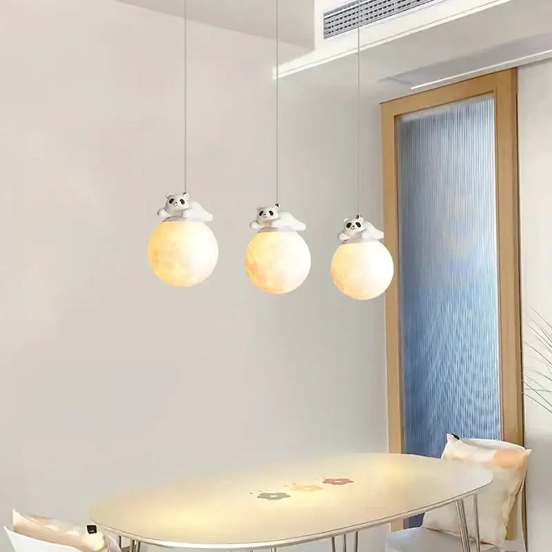 Modern white panda bear bedroom wall lamp with three hanging pendant lights featuring softly glowing spherical orbs