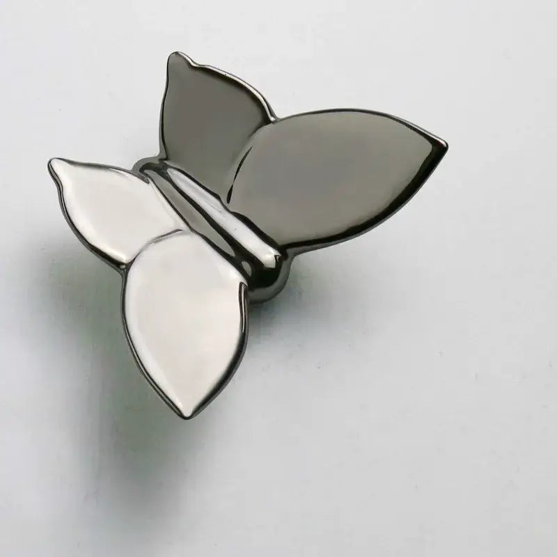 A sleek two-toned silver and black metal butterfly wall mount decorbites butterfly wall for kids room decor