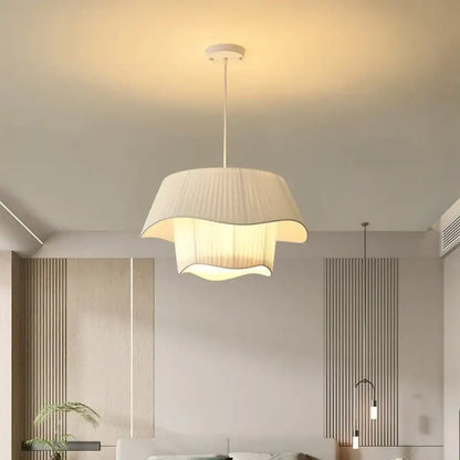 A modern pendant light with a soft cream-colored pleated fabric shade and sleek white ceiling mount for bedroom decorbites creamy style e27