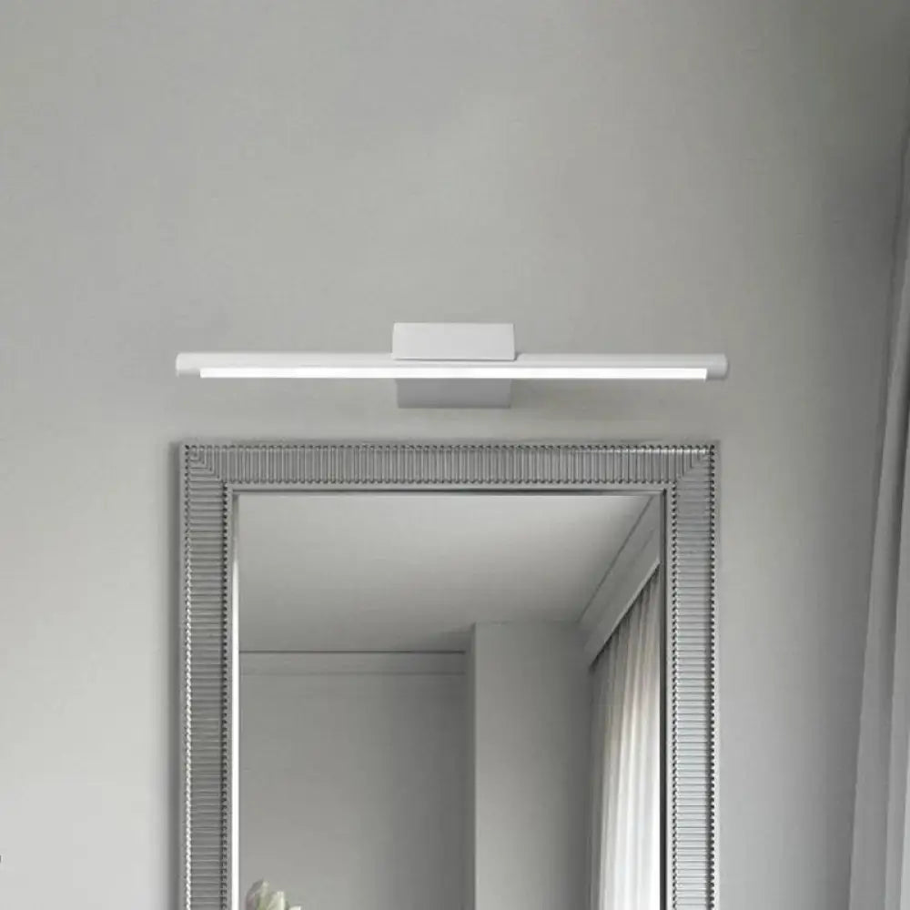 Modern white pole vanity lighting with sleek rectangular design mounted above framed mirror for bathroom use